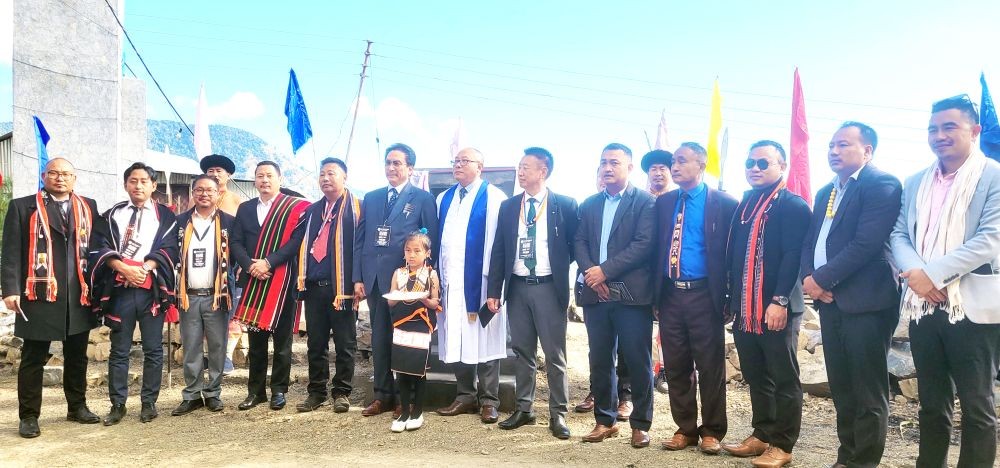 KG Kenye and other after unveiling commemorative plaque of CYF 14th Biennial General Conference at Pholami village on December 12. (Morung Photo)